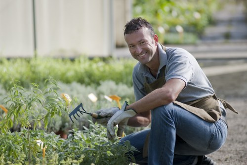 Volunteers moving plants to community charity